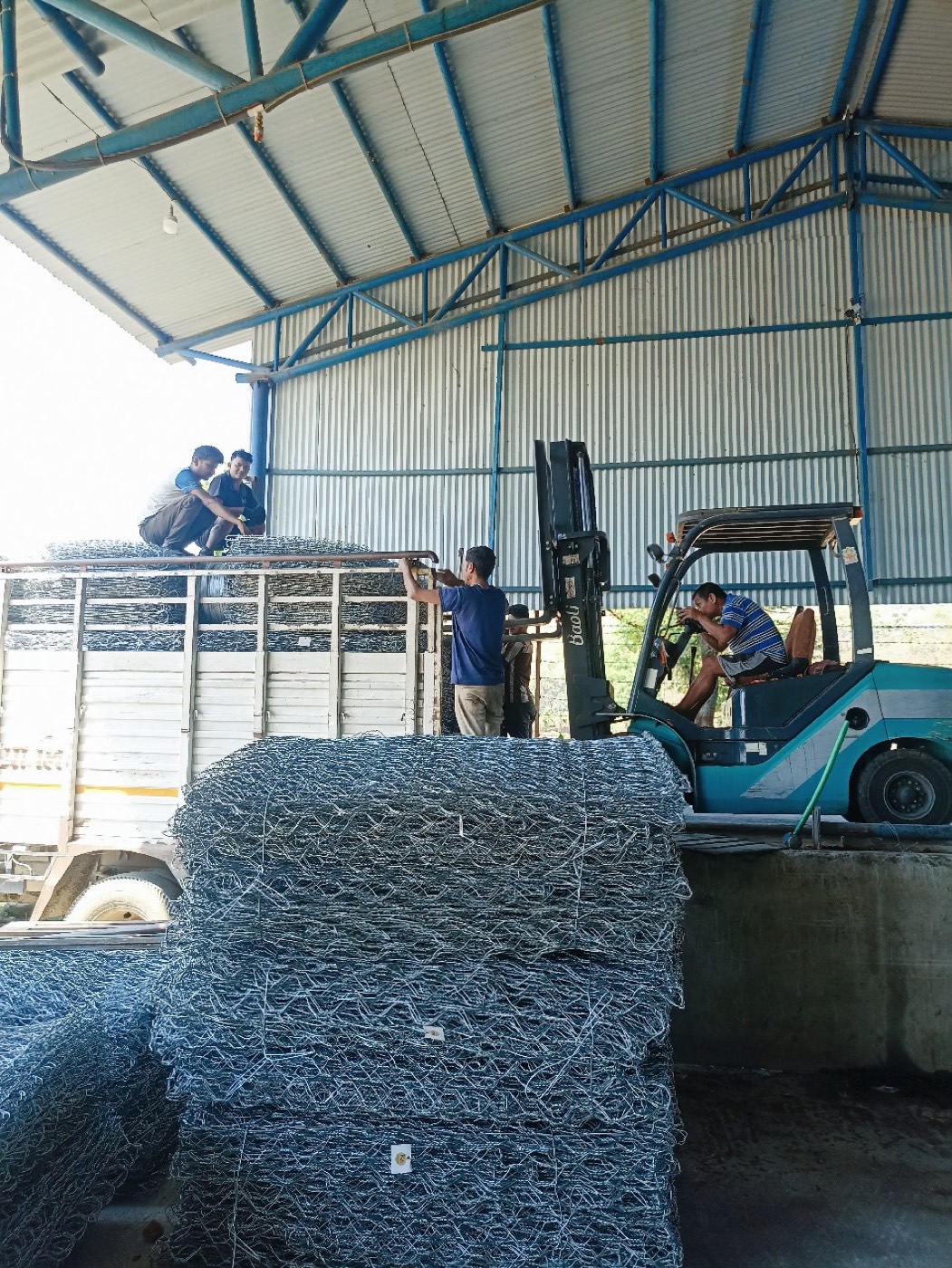 Forklift loading finished Gabion Boxes onto a truck at the Devchuli-5 factory